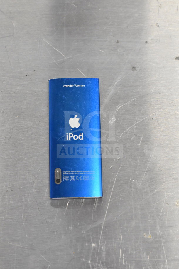 Blue Apple iPod with "Wonder Woman" engraving, model A1303, shows some wear.