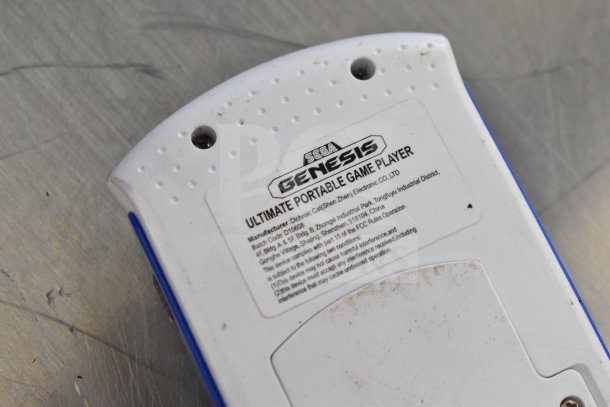 Sega Genesis Ultimate Portable Game Player back with visible label indicating manufacturer and batch code.