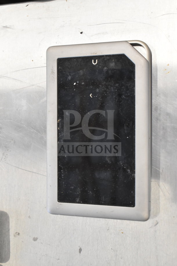 Genesis Ultimate portable game player, black face, silver frame, slight wear.