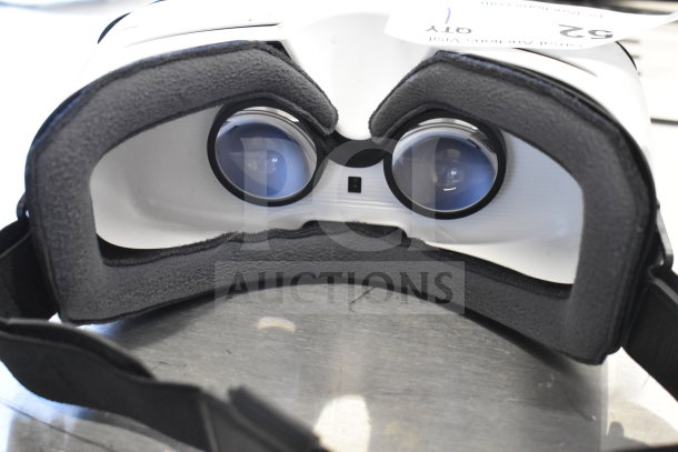 Samsung SM-R322 Gear VR Oculus headset, black and white, good condition, lens-focused view.