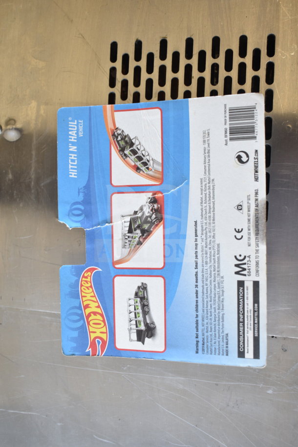 Hot Wheels box featuring Hitch N' Haul vehicle, slight tear in packaging, part of a 6-item auction lot.