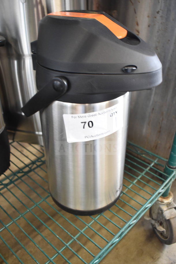Acopa Air Pot with a black lid and stainless steel body, shown in good condition on a metal shelf, with auction sticker.