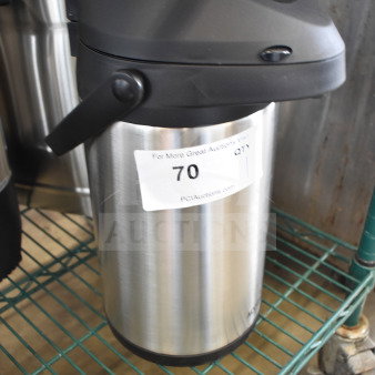 Acopa Air Pot with a black lid and stainless steel body, shown in good condition on a metal shelf, with auction sticker.