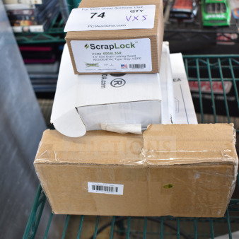 5 brand new items including ScrapLock 600SL35R locking drain strainer, Conair WCR14 alarm clock radio, ceramic sake cups. Boxes on shelf.