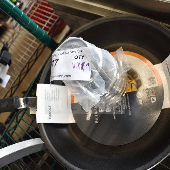 9 brand new scratch and dent items including a stainless steel malt cup collar and Vollrath fry pan, labeled and packaged.