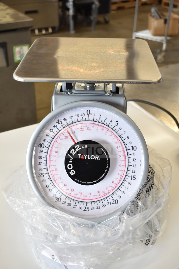 BRAND NEW Taylor THD50 50 lb. scale, slight scratches, heavy-duty, mechanical portion receiving, visible brand label.