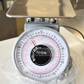BRAND NEW Taylor THD50 50 lb. scale, slight scratches, heavy-duty, mechanical portion receiving, visible brand label.