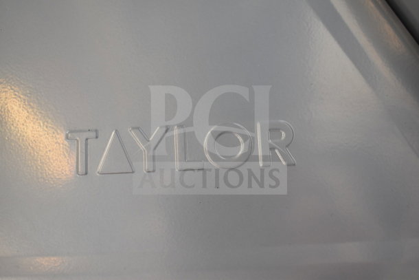Alt text: Taylor THD50 50 lb. heavy-duty mechanical scale with visible Taylor logo. Brand new, scratch and dent condition.