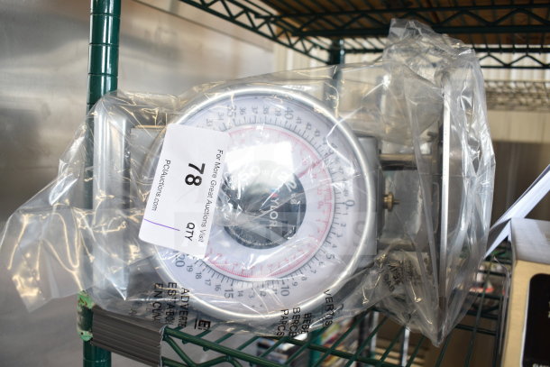 Brand new Taylor THD50 50 lb. mechanical scale, packaged and tagged, with minor scratches and dents visible.