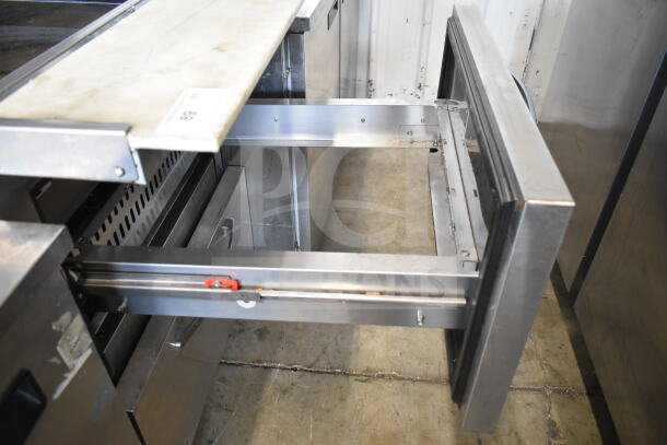 Turbo Air PST-28-12-D2-N commercial prep table with two drawers open, 115 volts, 1 phase, stainless steel finish.
