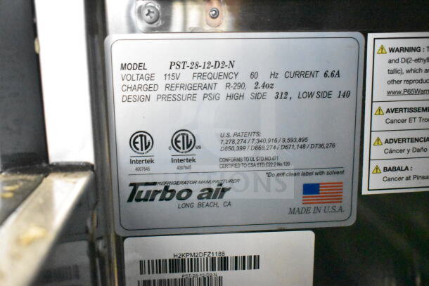 Turbo Air PST-28-12-D2-N prep table label. Shows 115V, 6.6A, refrigerant R-290, design pressure high 312, low 140 PSIG. Made in USA.