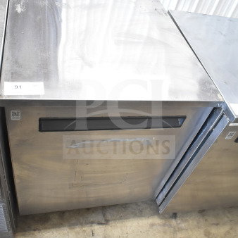 Delfield 406-STAR2 single door undercounter cooler, stainless steel, 115V, 1 phase, visible surface wear, model label intact.