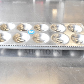 Metal ravioli form with twelve round molds and dual handles, in good condition. Blue "BB" label on top.