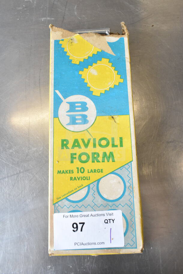 BB Ravioli Form with box, makes 10 large ravioli. Box has wear and tear, instructions noted on back. Auction label "97."