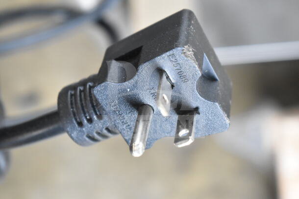 Close-up of the plug for a 2024 Avantco 177STE4SH Commercial 4 Well Steam Table, 208/240V, 1 Phase.