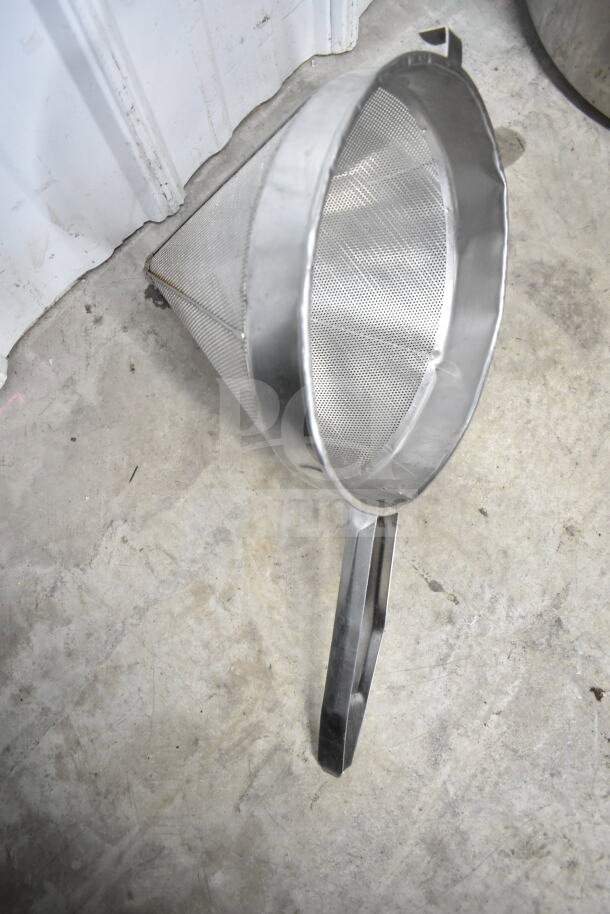 Stainless steel china cap strainer with fine mesh, in good condition. Durable handle, ideal for straining tasks.