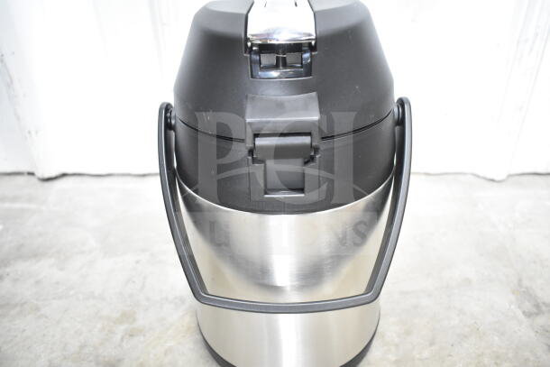 Stainless steel and black air pot with handle, in good condition, part of a lot including colander and stock pot.