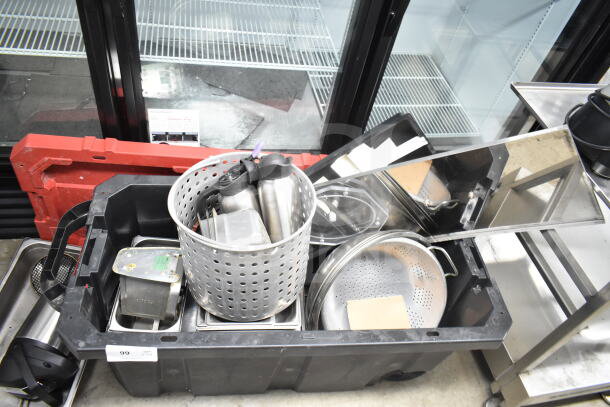 Lot of kitchen items including colander, stock pot, China cap strainer, air pot in a container; good condition.