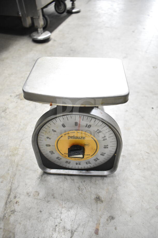 Pelouze scale model Y32R, visible wear, yellow dial, NSF certified. Measures up to 32 oz by 1/4 oz increments.