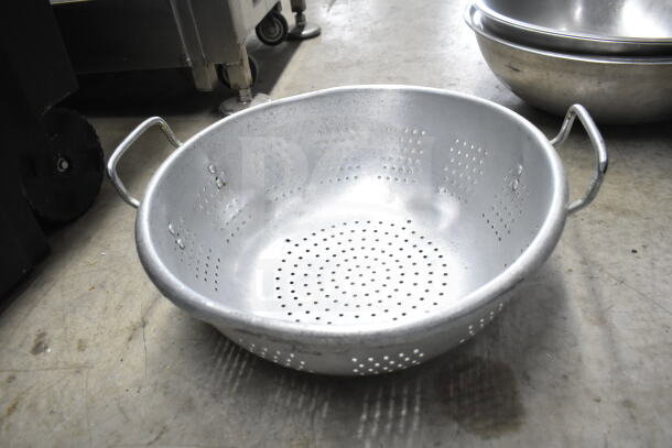 Metal colander with handles, perforated sides, used condition, part of auction lot with various kitchen items.