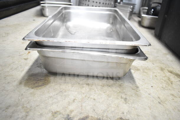 Lot with colander, stock pot, china cap strainer, air pot, and scale in used condition, showing minor wear.