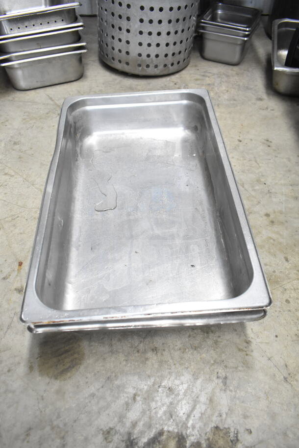 Stainless steel rectangular container, used, with visible scratches. Includes colander, stock pot, china cap strainer, air pot, scale.