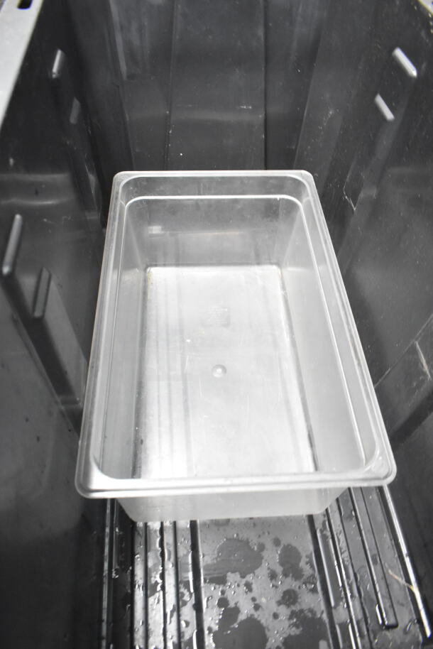 Lot of various kitchen items in plastic container; includes colander, stock pot, China cap strainer, air pot, scale.