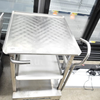 Face to Face Commercial Meat Slicer Stand with stainless steel top, two shelves, and wheels. Tag reads "101." Used condition.