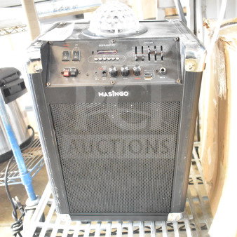 Masingo Soprano X1 Karaoke Machine, black, featuring control panel, LED indicators, and disco light on top. Good condition.