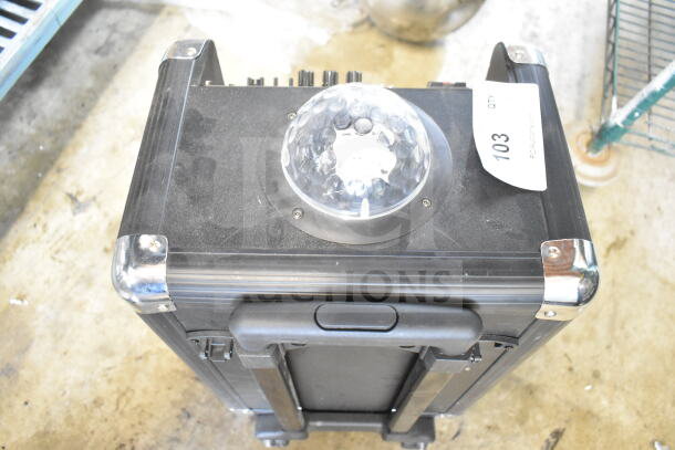 Masingo Soprano X1 Karaoke Machine, black with a dome light, handle, and protective metal corners. Auction tag "103".