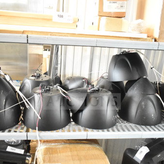 11 Crestron Saros PD6T-B-T-EACH speakers on metal shelves, wiring visible, light wear. Auction lot tags in view.