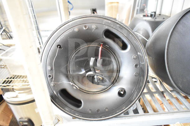 11 Crestron Saros PD6T-B-T-EACH speakers in used condition, featuring black enclosures and visible wiring.