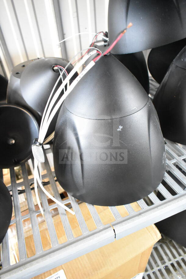 11 Crestron Saros PD6T-B-T-EACH speakers, black, gently used, visible wiring, staged on metal shelving.