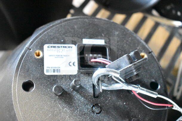11 Crestron Saros PD6T-B-T-EACH speakers with label showing model and CE marking, featuring connection ports.