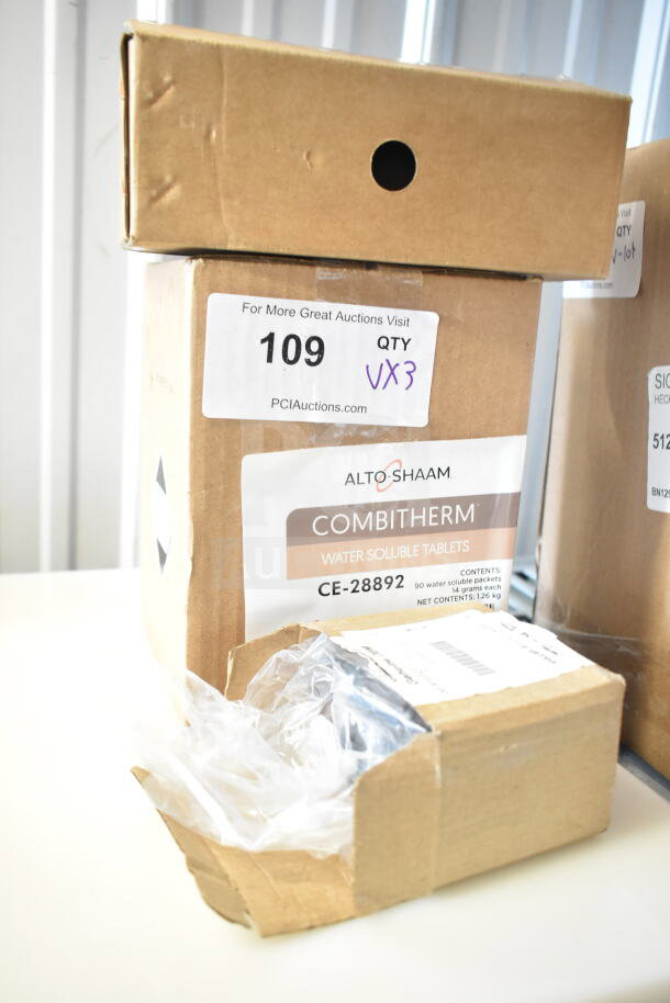 Brand new scratch and dent items including Hobart contactor, Alto Shaam CE-28892 water soluble tablets, and drip tray. Box labeled "VX3".