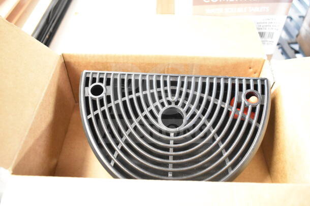 Boxed black drip tray with circular grid design. New condition. Background shows Alto Shaam water soluble tablets packaging.