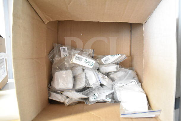 Box of assorted brand new scratch and dent deli tags, including 512XKD105 and 512XKD710BK, packaged individually.