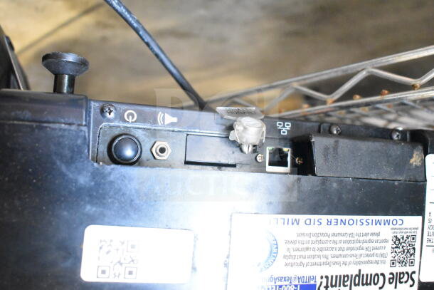 2016 Hobart HTi-7LH commercial food scale, visible controls and ports, tested and working condition, model label shown.