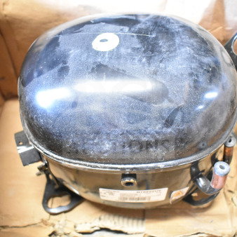 Embraco NT6222UV Compressor in box, 115 Volts, 1 Phase, shows moderate wear, visible label with specifications.