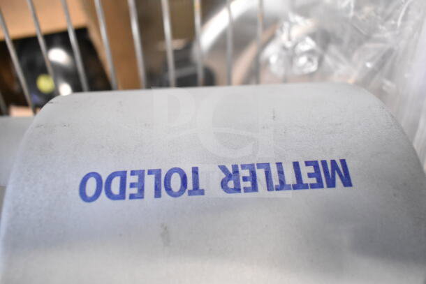 Mettler Toledo commercial countertop food portioning scale, clean condition, tested and working, with visible brand logo.