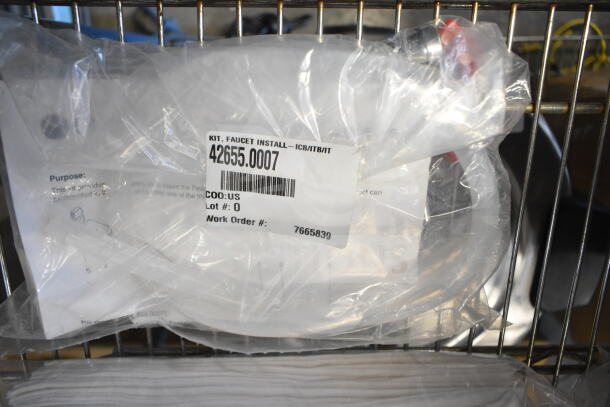 5 various items including 42655.0007 faucet kit in packaging. Tags show model number, COO: US.
