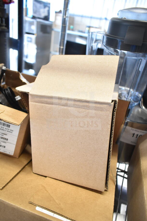 Three boxed items including a Wren camera and SVW PTZ adapter, condition unknown. Boxes have labels but details are unclear.