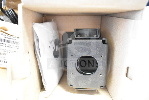 Box containing Wren camera, model RC-WM-HI-AI, and SVW PTZ adapter. Items are new, with visible packaging and labels.