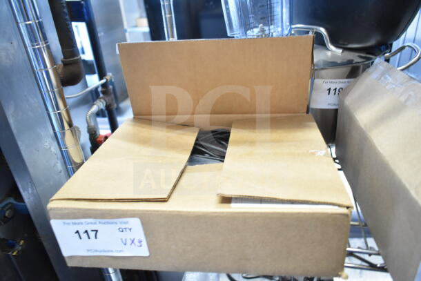 Cardboard box labeled "QTY VX3" containing auction items, including Wren camera and SVW PTZ adapter. Condition unknown.