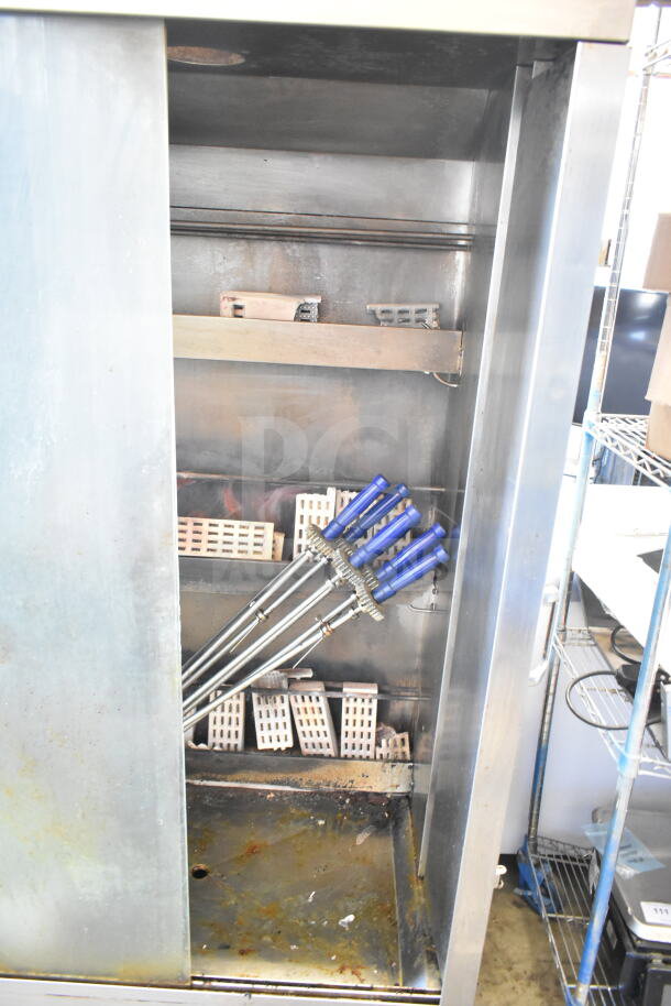 Attias Commercial Rotisserie Oven, natural gas-powered, 70,000 BTU, stainless steel, on commercial casters. Good condition.
