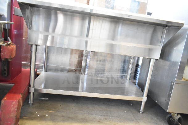 Commercial stainless steel steam table with undershelf, clean condition, sturdy legs, ideal for professional kitchens.
