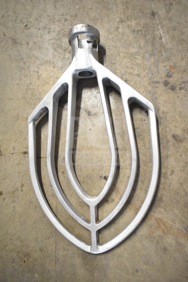Attias USA 60 dough mixer paddle attachment on concrete floor, part of a 60-quart planetary mixer set.