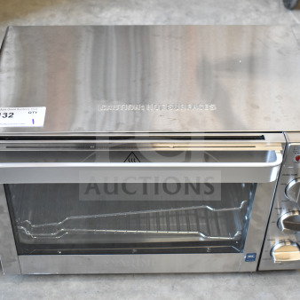 Brand new Waring WCO500X half-size countertop convection oven, 120 volts, display tag "132 QTY," caution label visible.