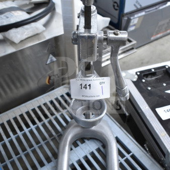 Nemco 55850 Countertop Manual Juicer, metal construction, visible auction tag indicating item number 141, used condition.