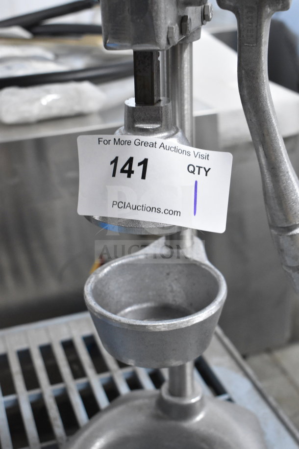Nemco 55850 Countertop Manual Juicer, metal construction, good condition, auction tag showing number 141.